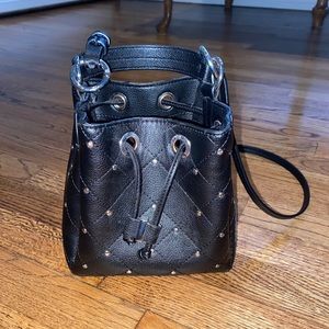 Black and silver drawstring crossbody